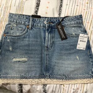 Blank NYC Distressed Denim Mini Skirt with Lace Trim